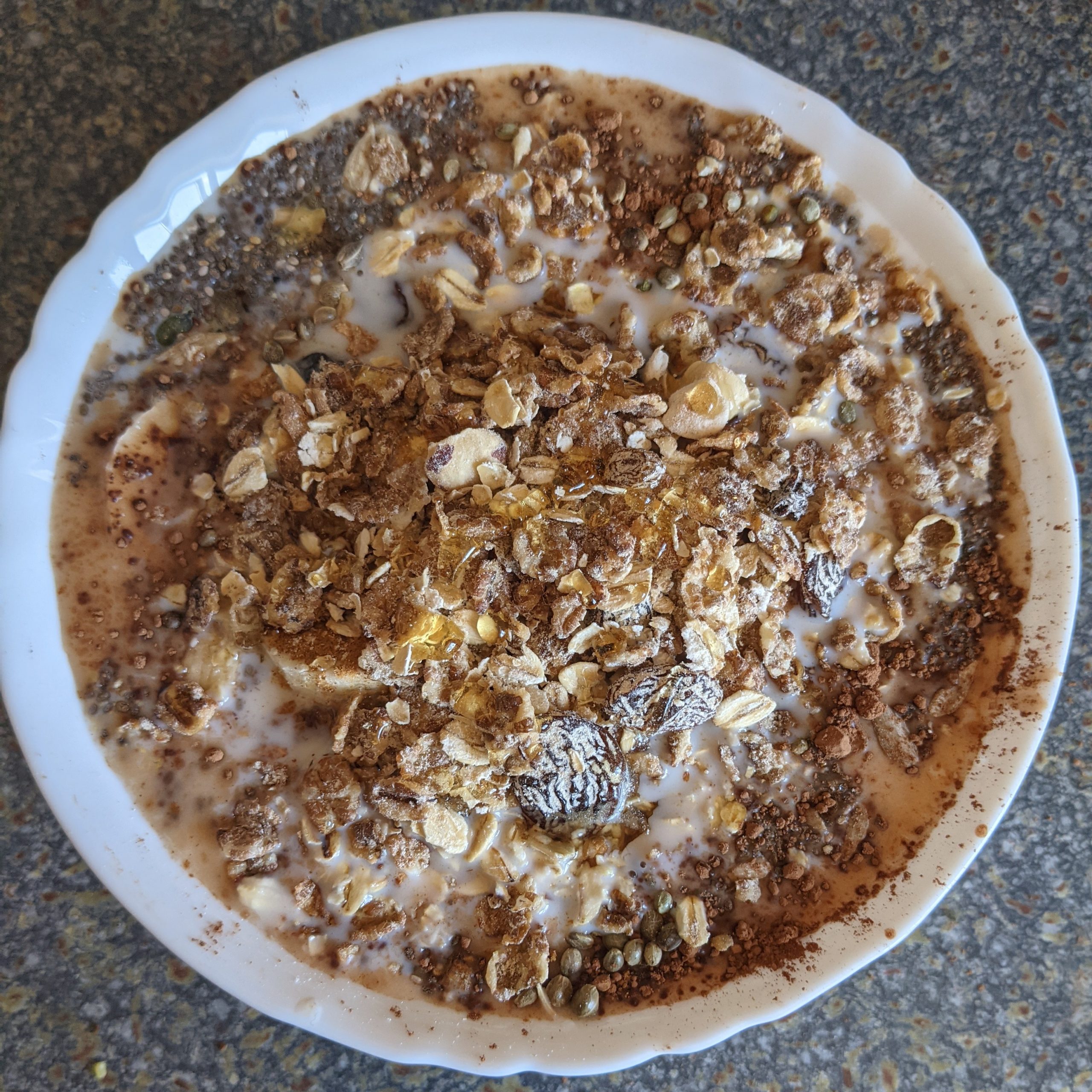 eating-a-healthy-breakfast-with-muesli-chia-seeds-sunflower-seeds-pumpkin-seeds-hemp-seeds-raw-cacao-and-cinnamon-brazil-nuts-almonds