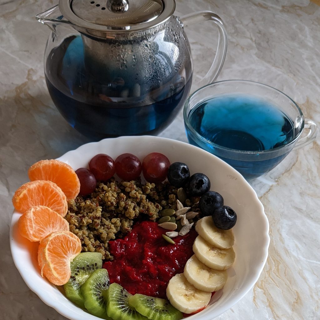 ginger-powder-beetroot-porridge-with-moringa-quinoa-and-fruits-sunflower-seeds-pumpkin-seeds-healthy-breakfast-recipes-rainbow-breakfast-bowl-blue-pea-flower-tea
