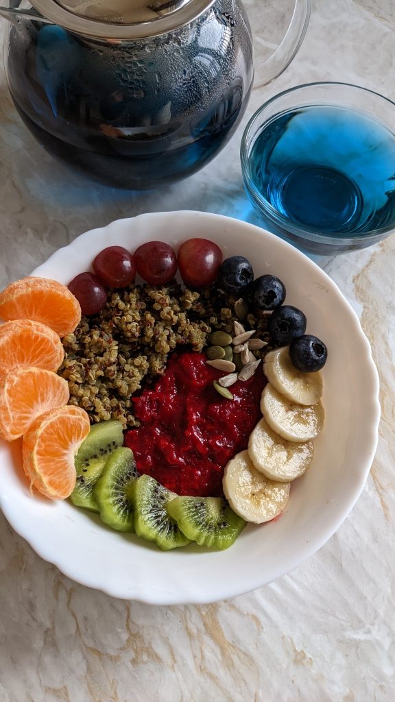 ginger-powder-beetroot-porridge-with-moringa-quinoa-and-fruits-sunflower-seeds-pumpkin-seeds-healthy-breakfast-recipes-rainbow-breakfast-bowl-blue-pea-flower-tea