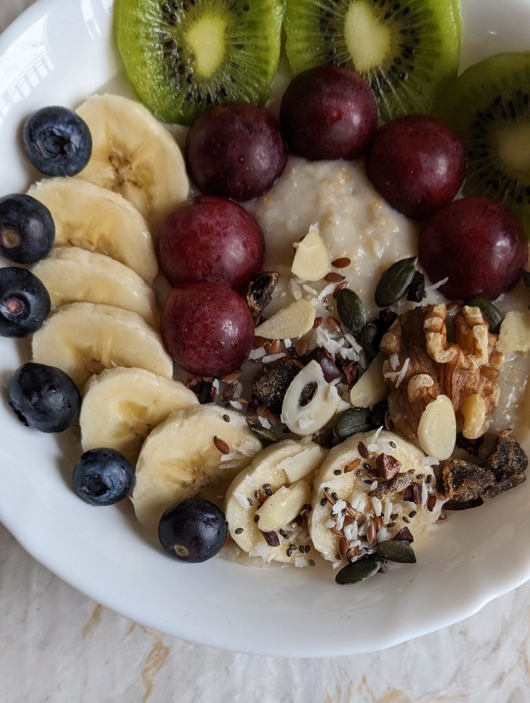 classic-porridge-recipe-with-fruits-better-food-mood-breakfast-topper-pumpkin-seeds-chia-seeds-flaxseed-walnuts-dates-coconut-cacao-nibs-almond-flakes