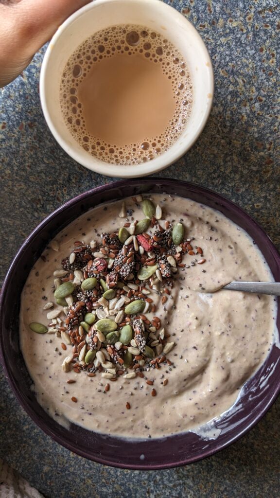 avocado smoothie bowl with mixed seeds for eating